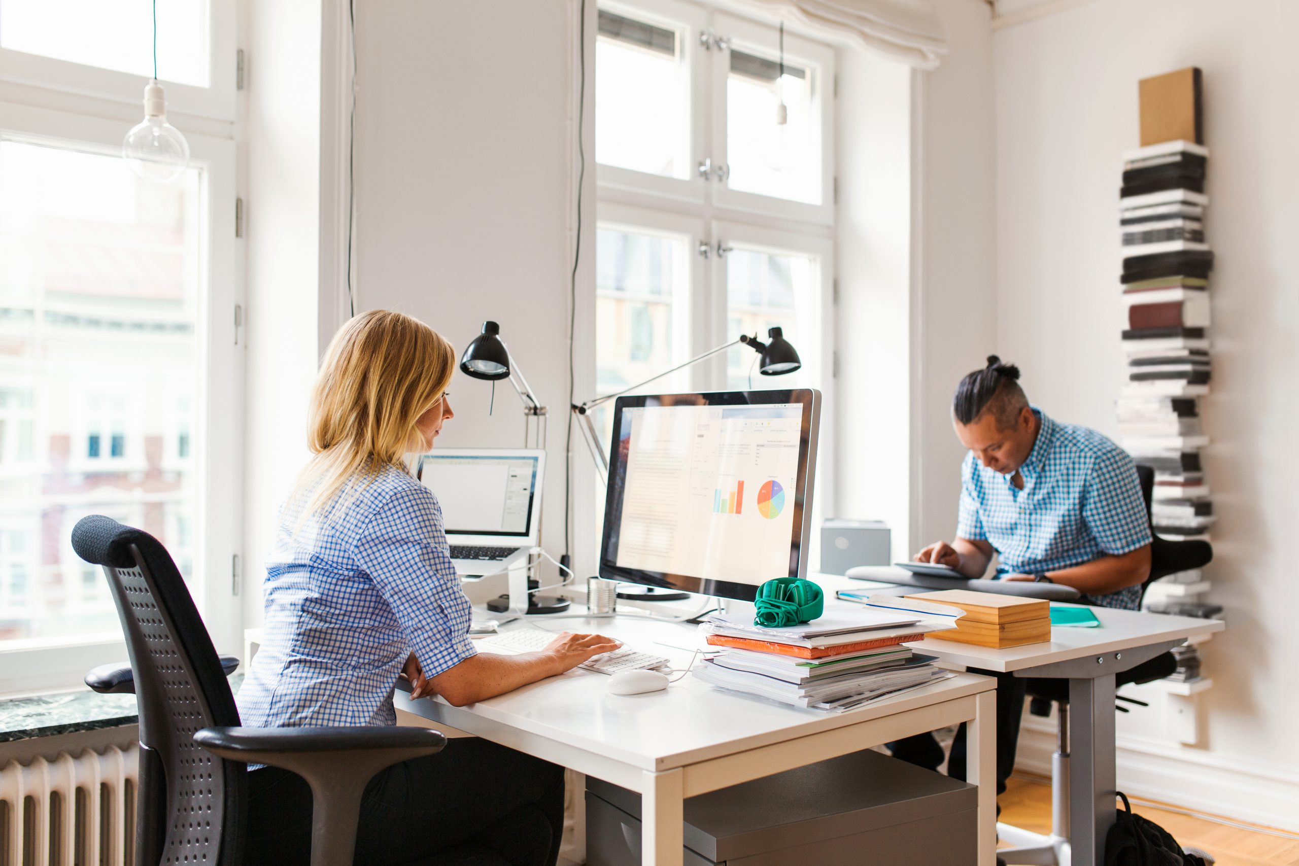 Young coworkers working on computer